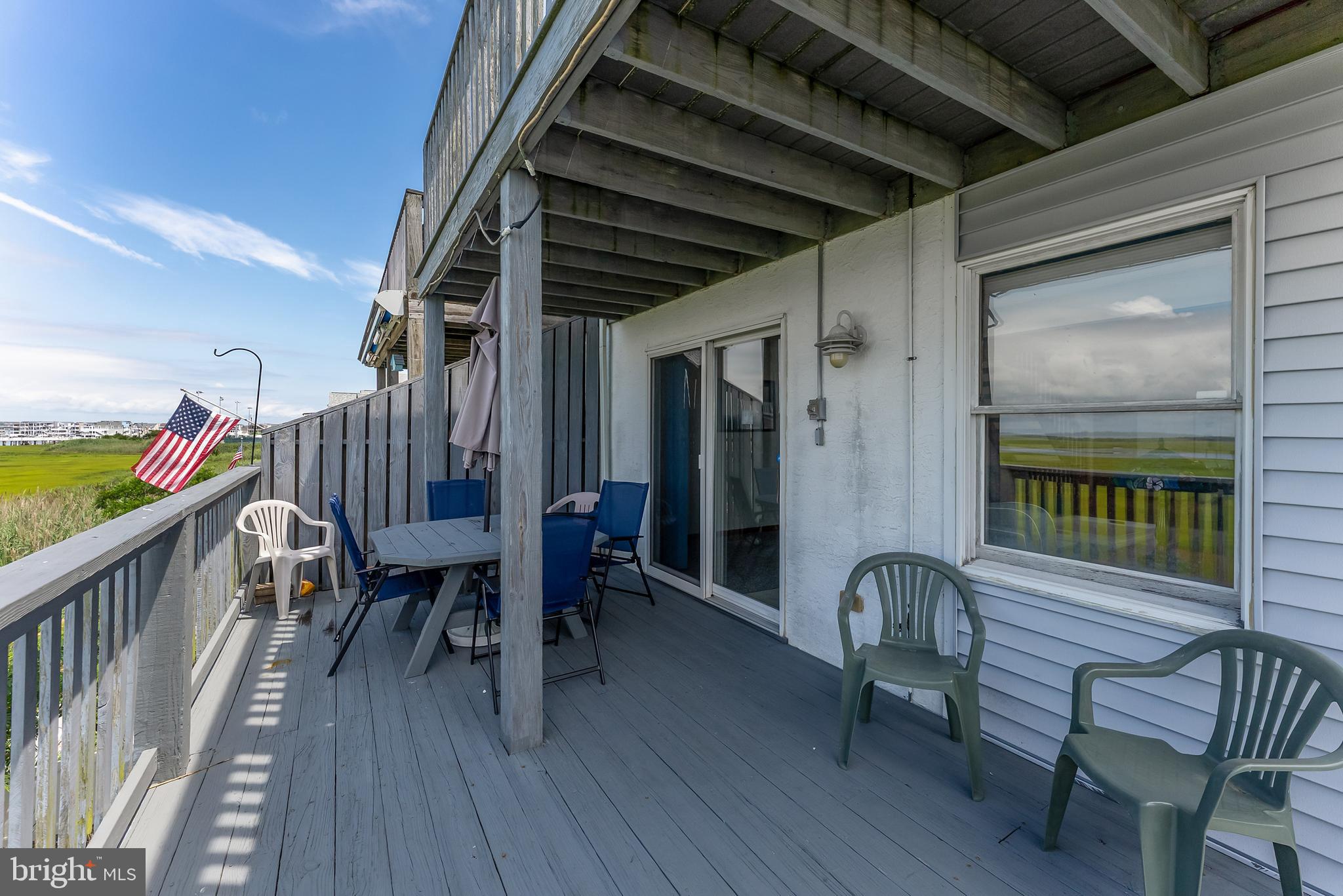6500 Central Avenue, Unit SOUTH Sea Isle City, NJ 08243 - Photo 44 of 54 a porch with seating space and furniture