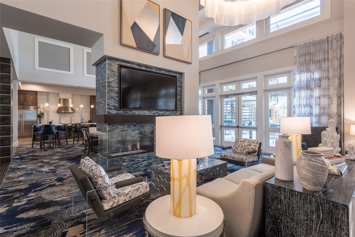 3100 Kramer Lane, Unit 501 Austin, TX 78758 - Photo 7 of 18 a living room with furniture a flat screen tv and a fireplace