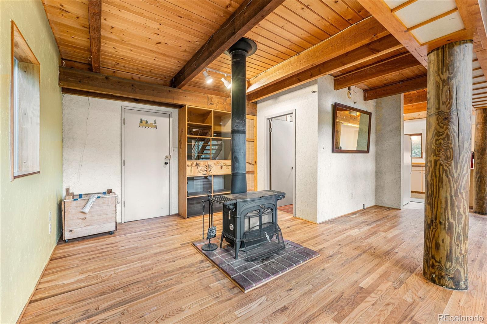 198 Range Road Nederland, CO 80466 - Photo 18 of 40 a view of a livingroom with furniture and windows