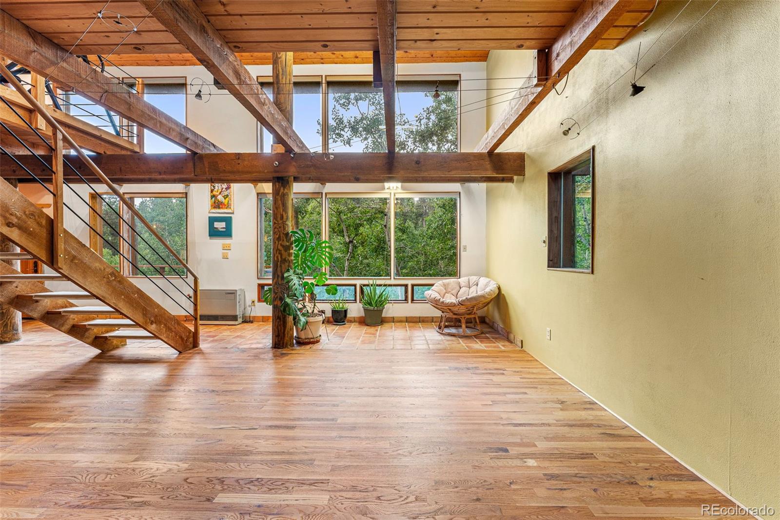 198 Range Road Nederland, CO 80466 - Photo 19 of 40 a view of an entryway with wooden floor