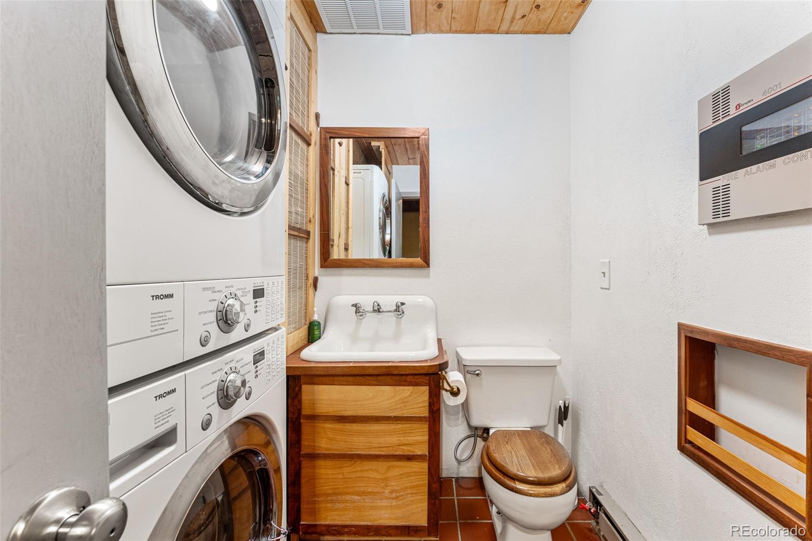 198 Range Road Nederland, CO 80466 - Photo 20 of 40 a bathroom with a toilet a sink and a mirror