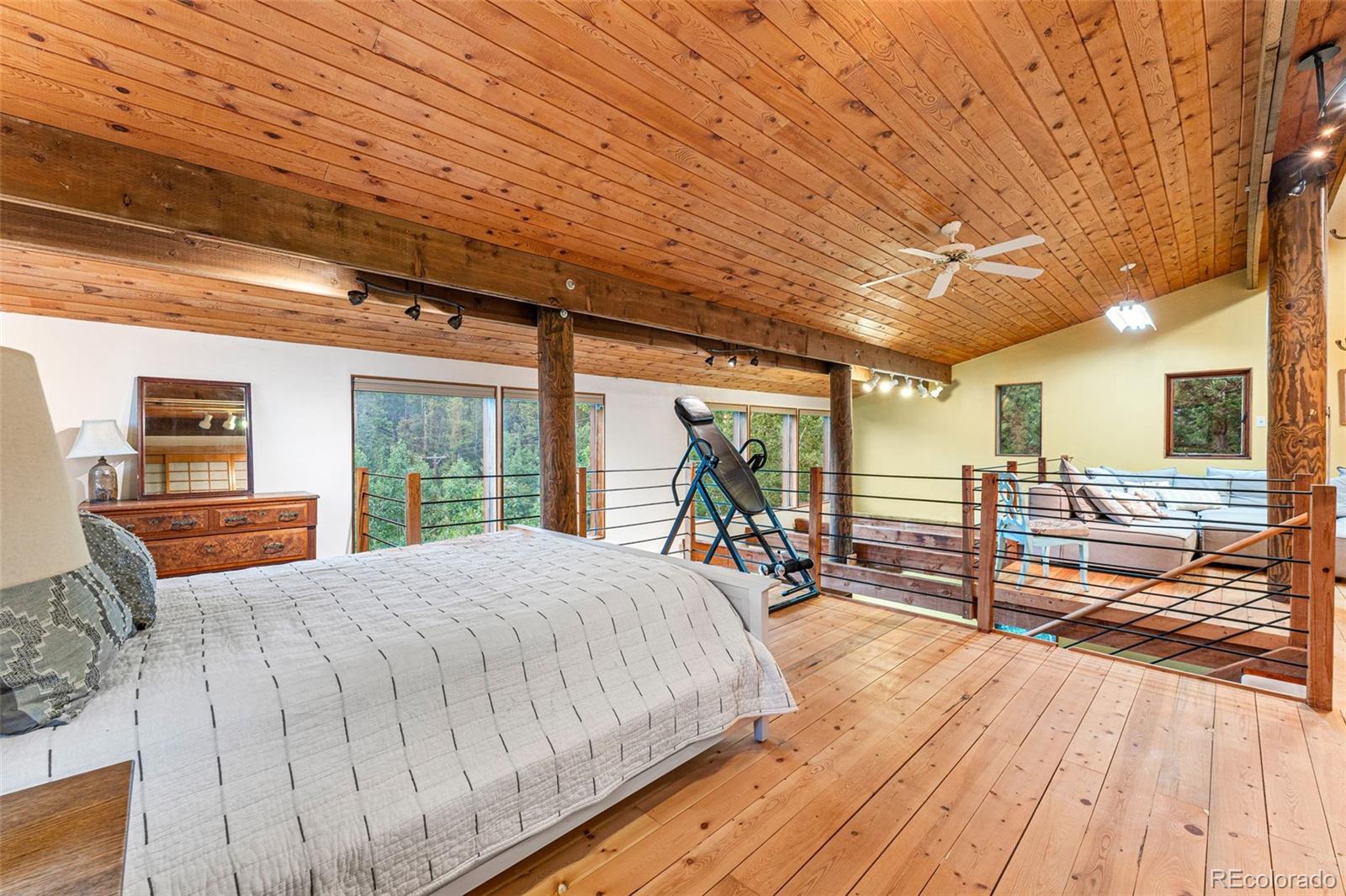 198 Range Road Nederland, CO 80466 - Photo 24 of 40 a large bed sitting in a spacious bedroom next to a window