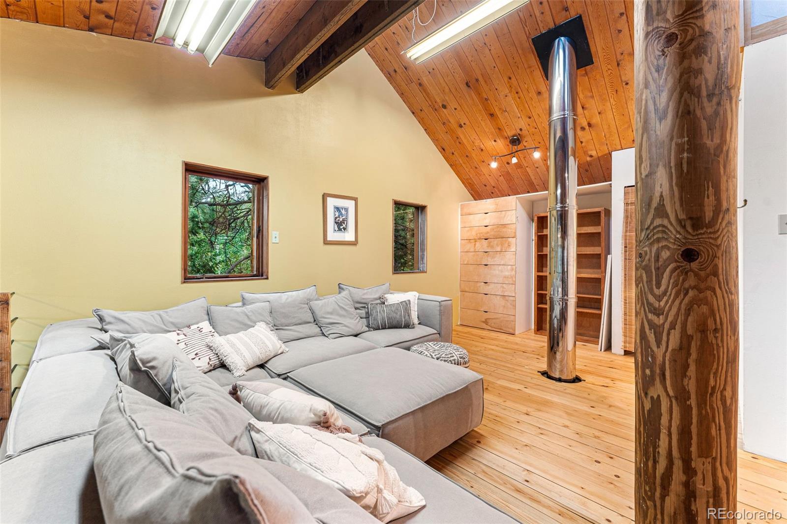 198 Range Road Nederland, CO 80466 - Photo 26 of 40 a living room with furniture and a window