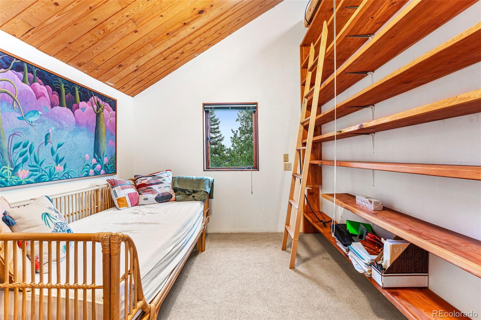 198 Range Road Nederland, CO 80466 - Photo 30 of 40 a bedroom with two beds and a window