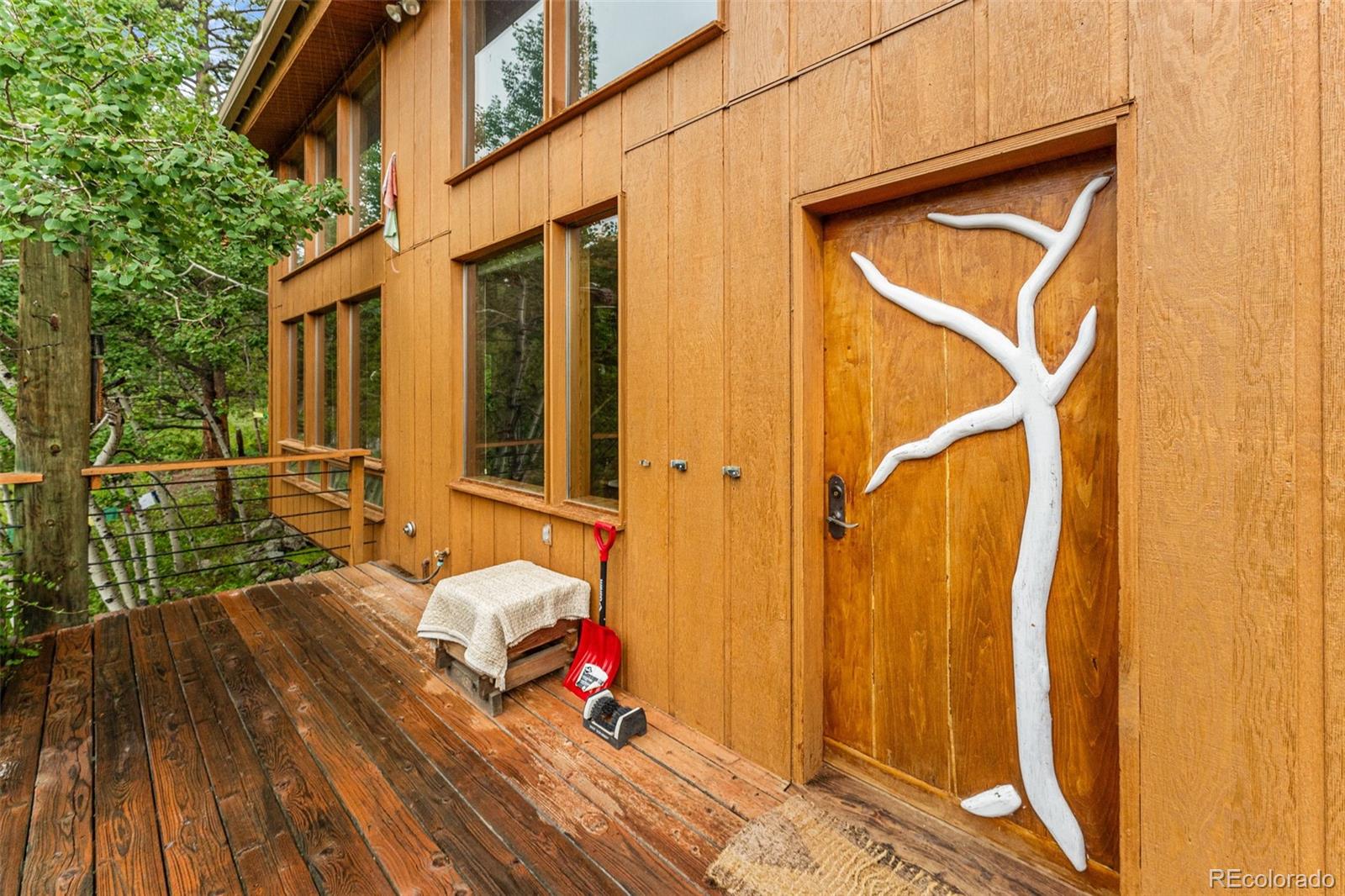 198 Range Road Nederland, CO 80466 - Photo 5 of 40 a backyard of a house with seating space