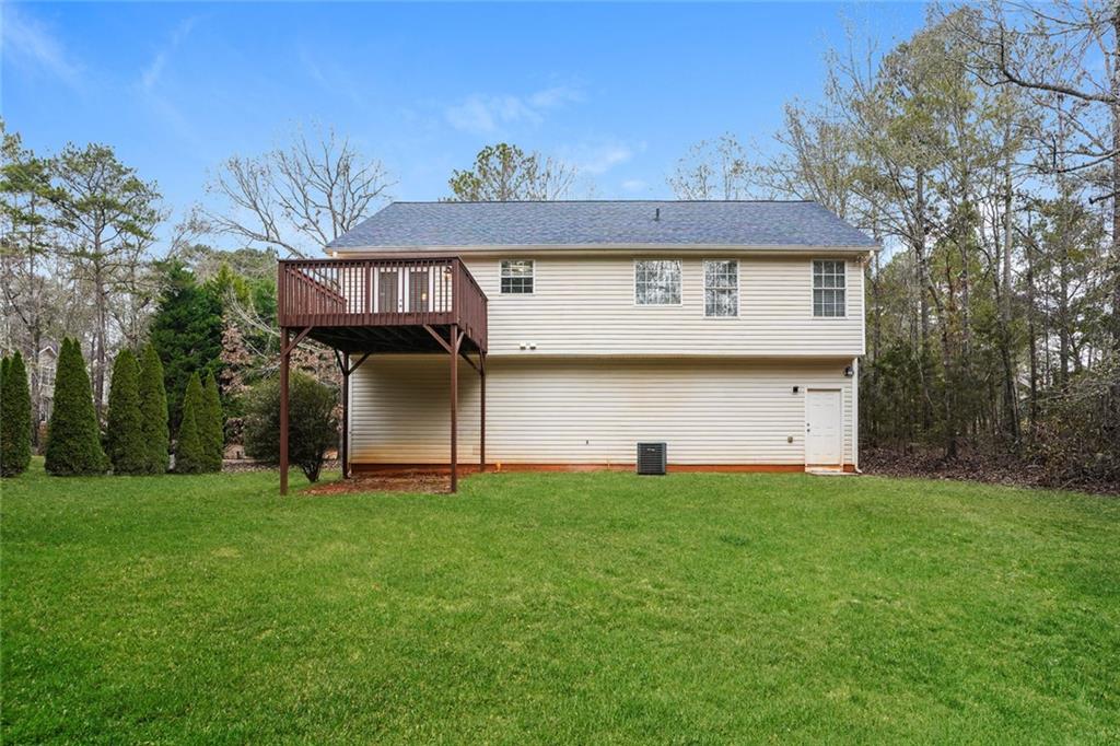 1024 Miss Amber Way Locust Grove, GA 30248 - Photo 4 of 25 a view of a house with a yard