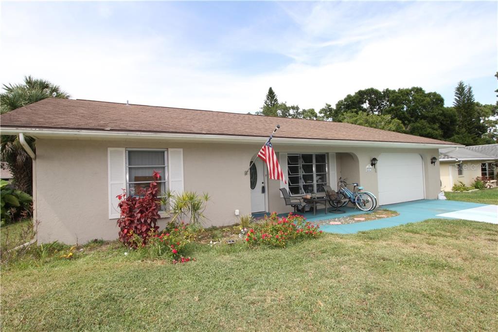 641 Darwin Road Venice, FL 34293 - Photo 1 of 1 front view of a house with a yard