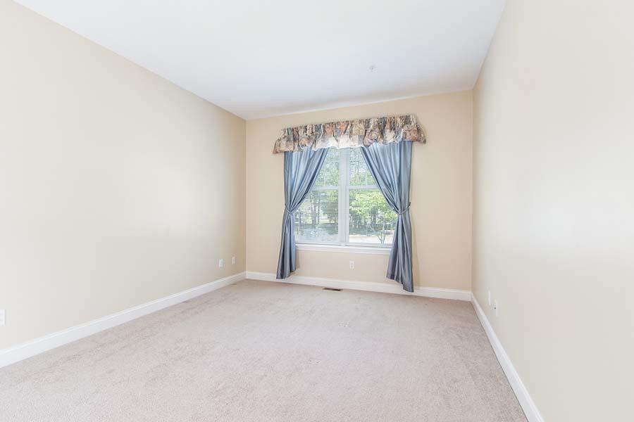 22 Southport Drive Mashpee, MA 02649 - Photo 18 of 27 an empty room with windows