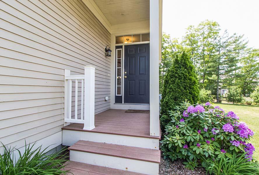22 Southport Drive Mashpee, MA 02649 - Photo 2 of 27 a view of a pathway of the house with potted plants