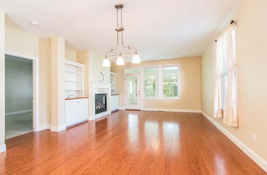 22 Southport Drive Mashpee, MA 02649 - Photo 4 of 27 a view of an empty room with window and wooden floor