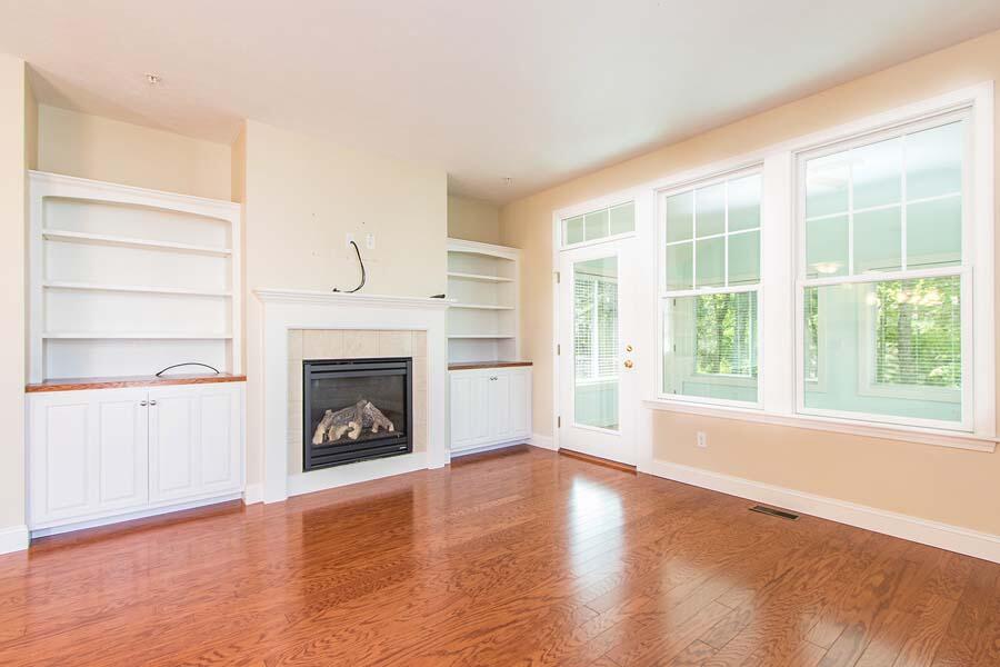 22 Southport Drive Mashpee, MA 02649 - Photo 9 of 27 a view of an empty room with a fireplace and a window