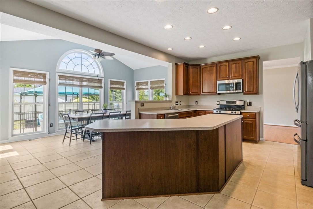 6965 Alydar Circle Victor, NY 14564 - Photo 8 of 44 Kitchen w/Island Seating for Everyone