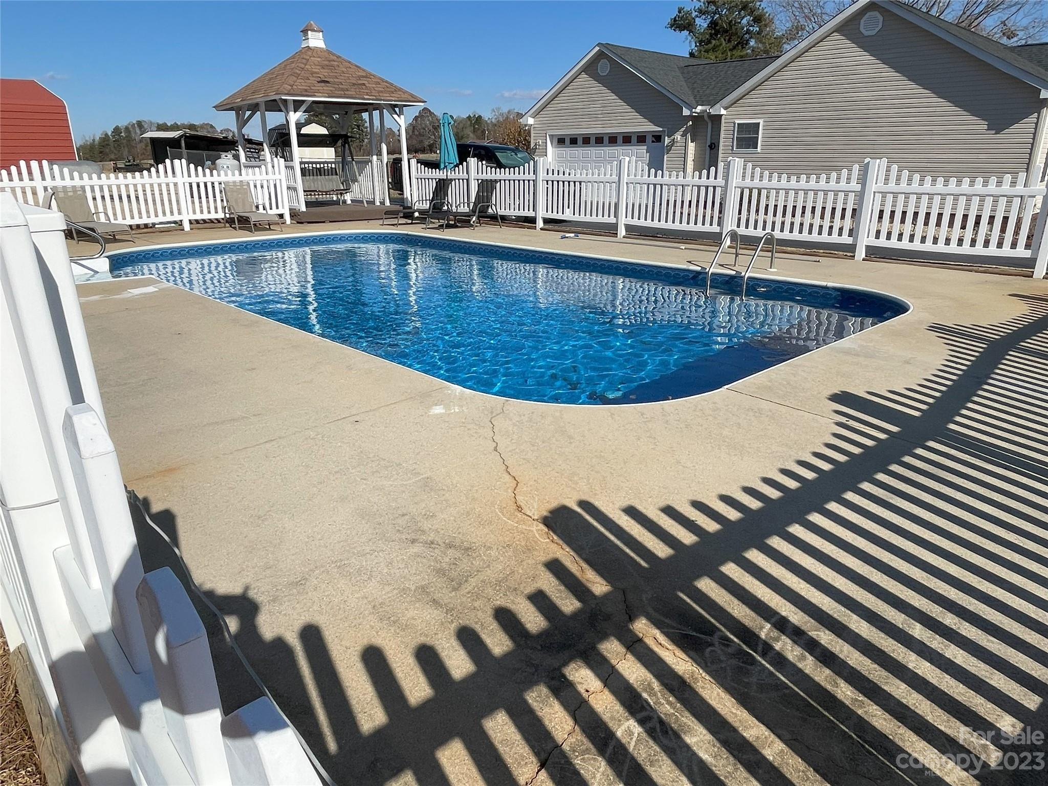 135 Mountain Road Cleveland, NC 27013 - Photo 14 of 27 a view of a house with swimming pool and sitting area
