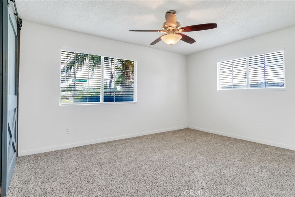 8955 Holly Lane Riverside, CA 92503 - Photo 7 of 32 an empty room with a window