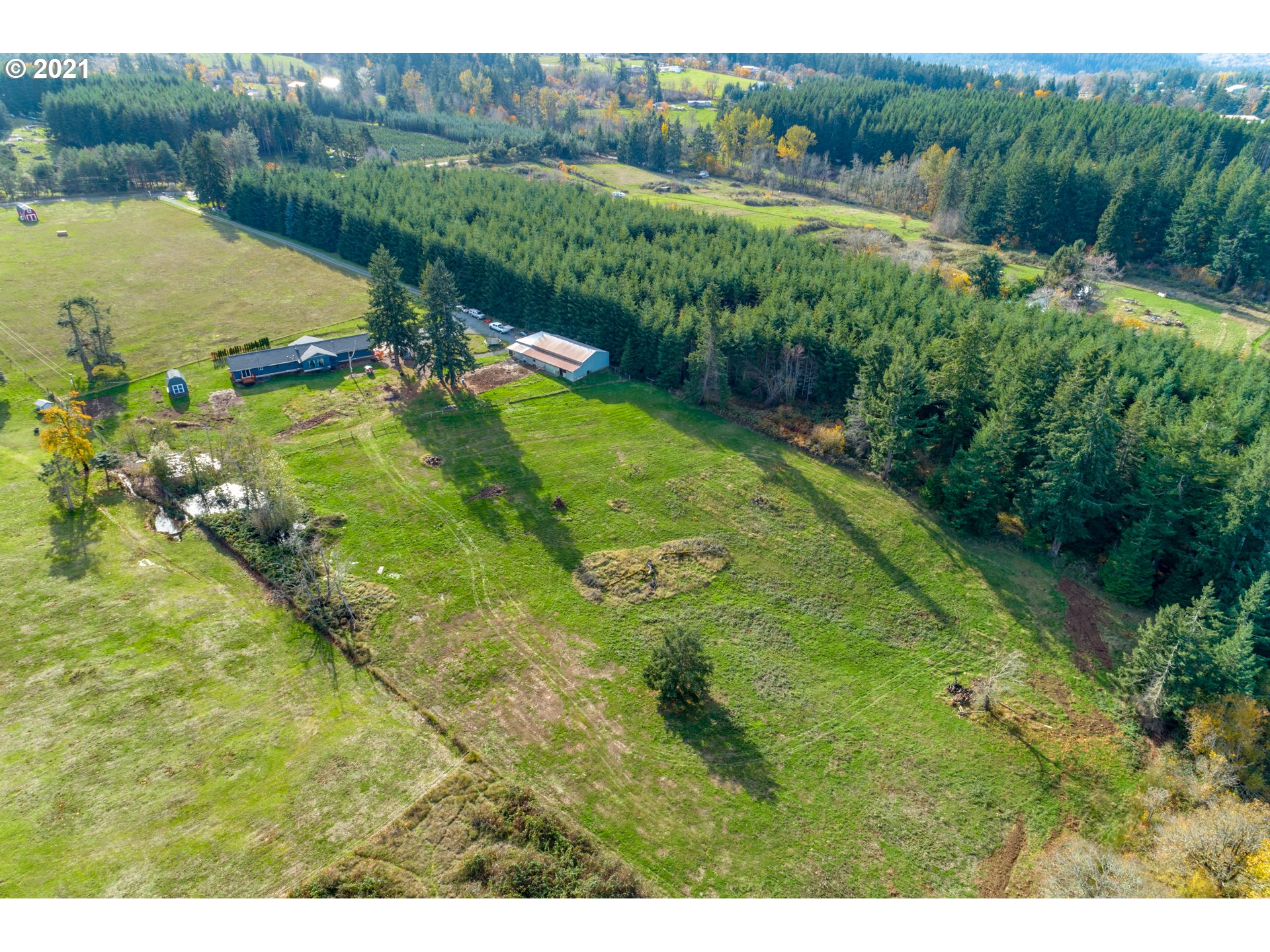 15587 South Pierce Road Molalla, OR 97038 - Photo 25 of 28 a view of a lake with a yard
