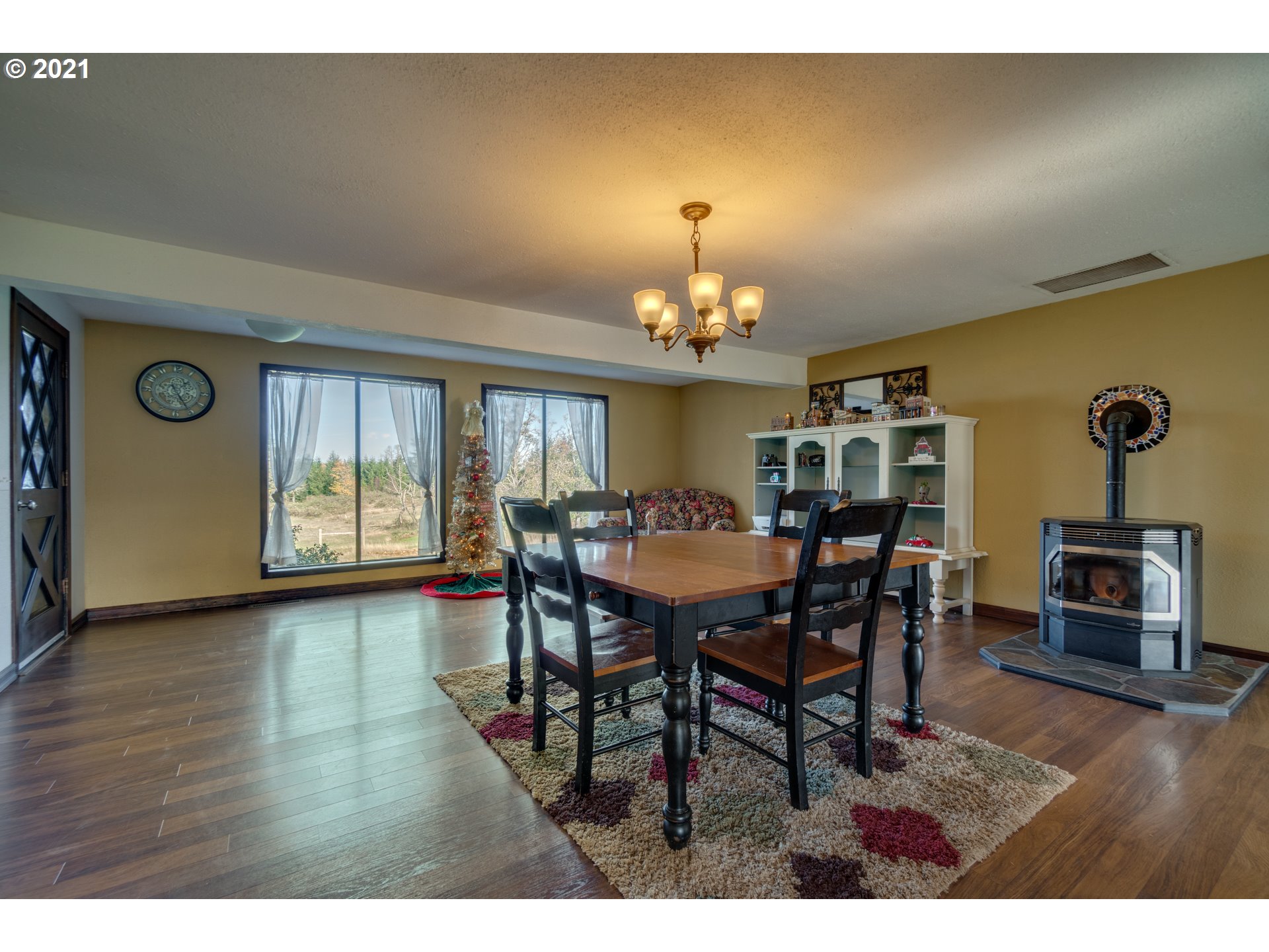 15587 South Pierce Road Molalla, OR 97038 - Photo 5 of 28 a view of a dining room with furniture and chandelier