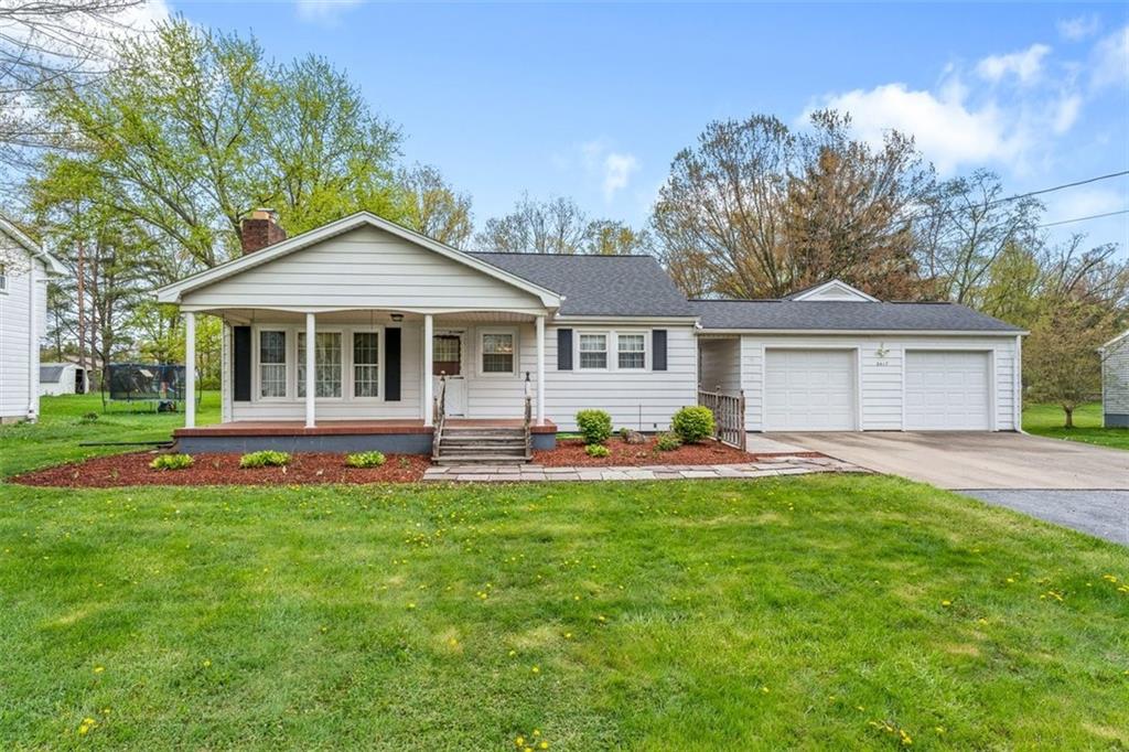 2417 Ridgewood Court New Castle, PA 16101 - Photo 1 of 3 a front view of a house with a yard and porch