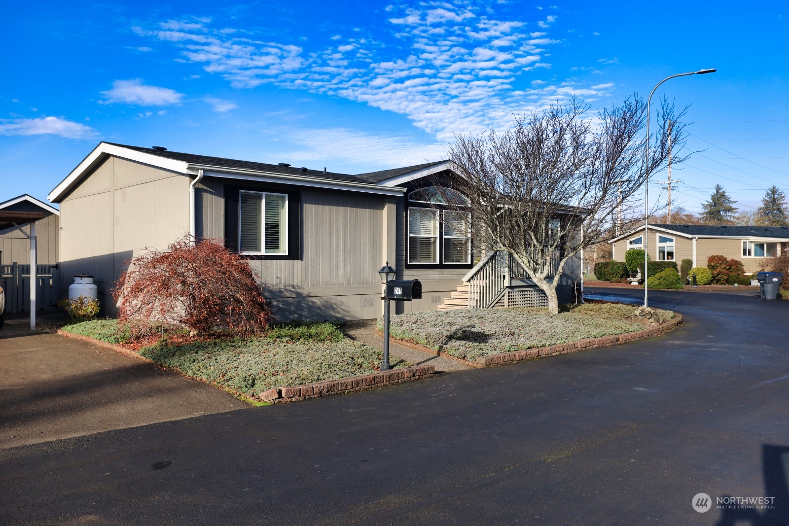 247 Ho Hum Lane Aberdeen, WA 98520 - Photo 1 of 24 a house that has a tree in front of it