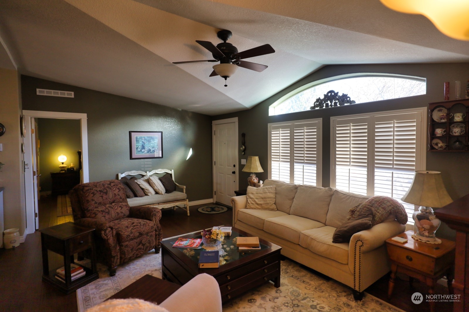 247 Ho Hum Lane Aberdeen, WA 98520 - Photo 14 of 24 a living room with furniture a ceiling fan and a window