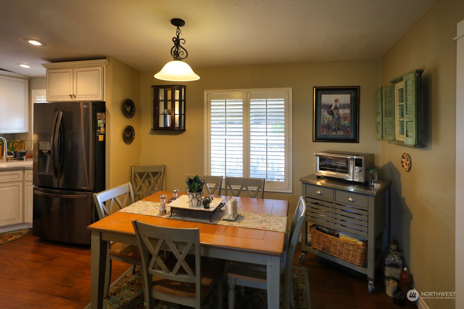 247 Ho Hum Lane Aberdeen, WA 98520 - Photo 10 of 24 a kitchen with stainless steel appliances granite countertop a stove refrigerator and a dining table with wooden floor