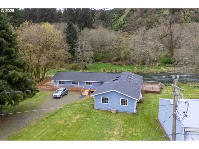 an aerial view of houses with yard