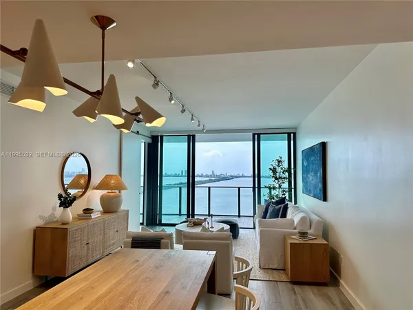 a dining room with furniture and windows