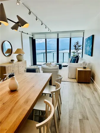 a kitchen with a table and chairs