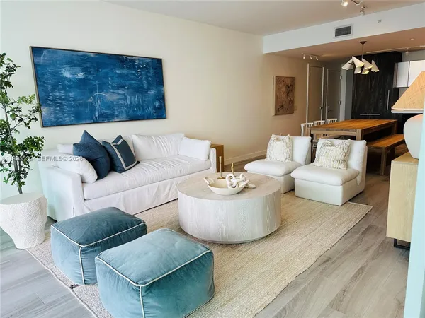 a living room with furniture and a rug