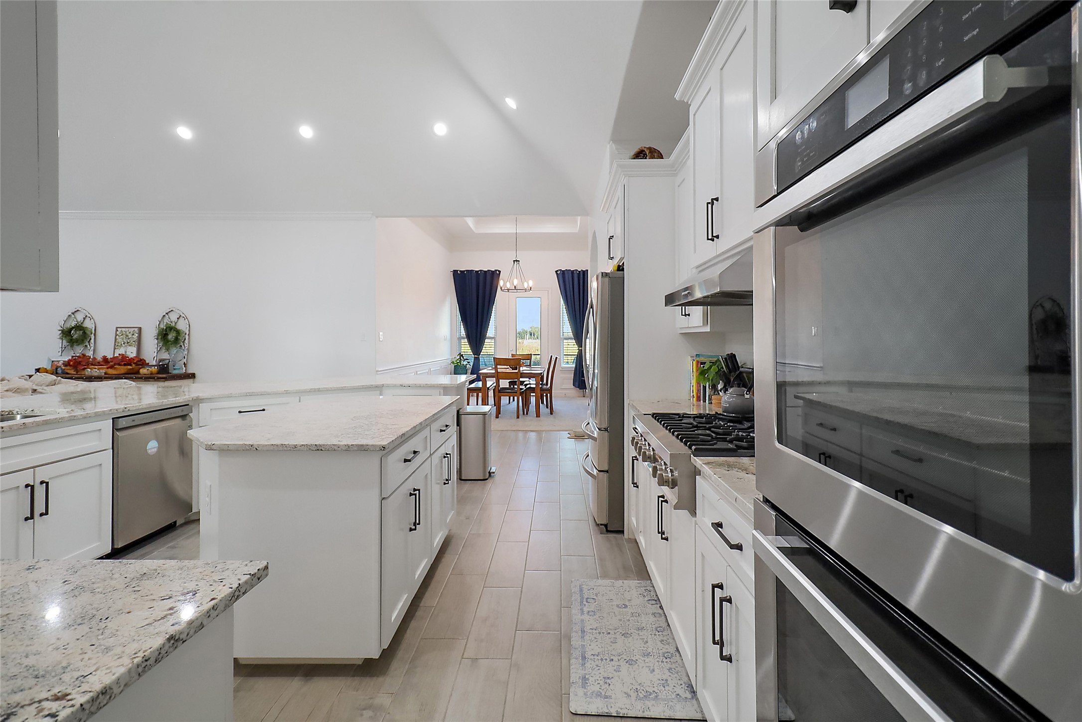 719 Cold Spring Drive Baytown, TX 77523 - Photo 11 of 33 a kitchen with stainless steel appliances a sink stove and refrigerator
