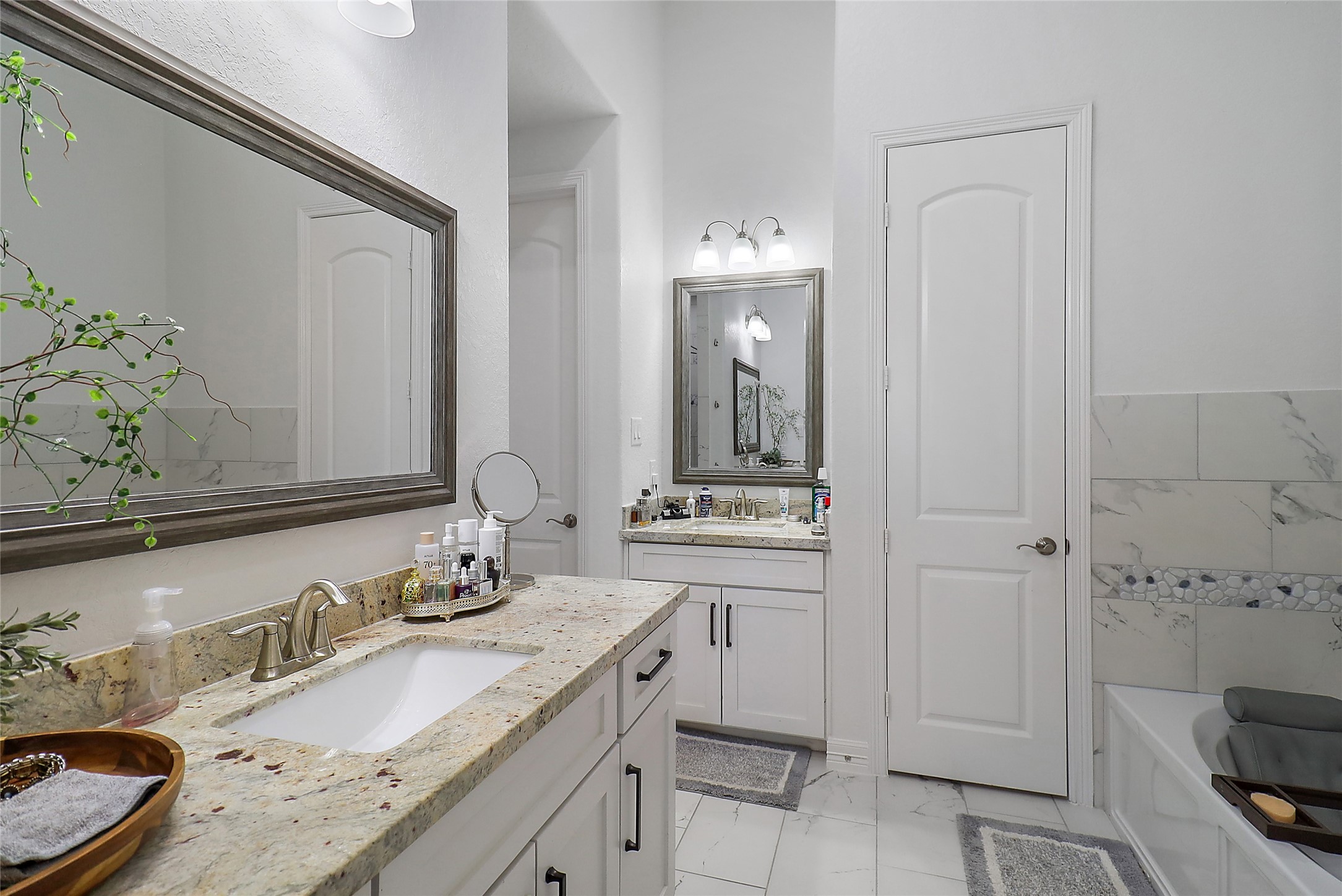 719 Cold Spring Drive Baytown, TX 77523 - Photo 20 of 33 a bathroom with a granite countertop sink and a mirror