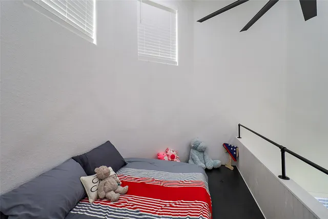 a bedroom with a bed and window