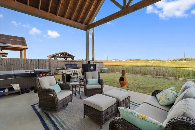 a roof deck with couch and outdoor view