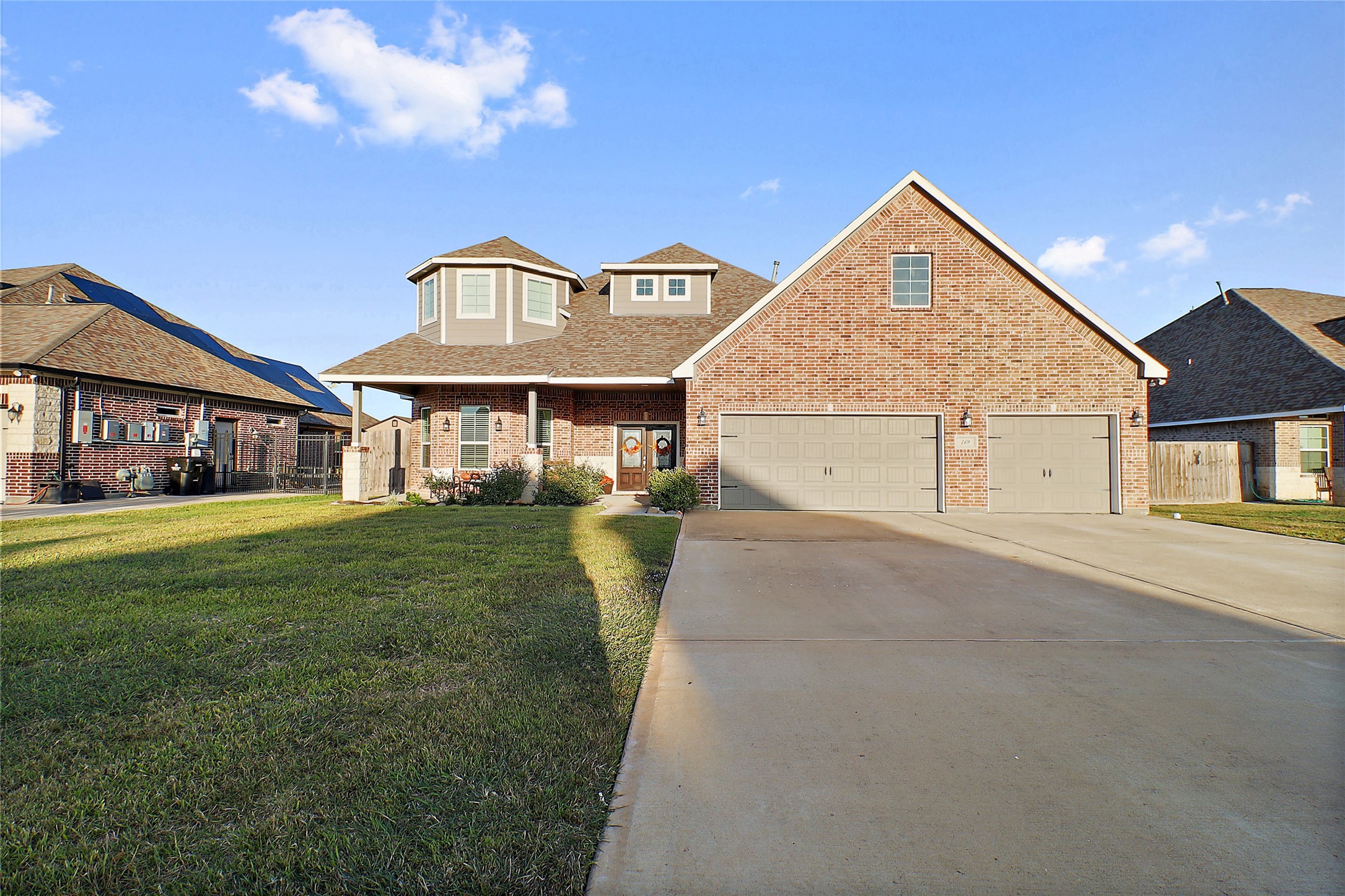 719 Cold Spring Drive Baytown, TX 77523 - Photo 3 of 33 a front view of a house with a yard and garage