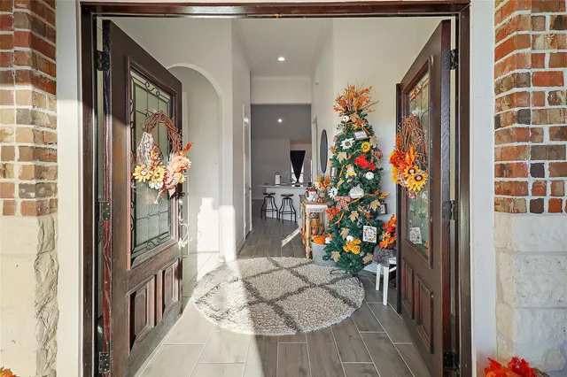 a view of entryway with a flower pot and a wooden floor