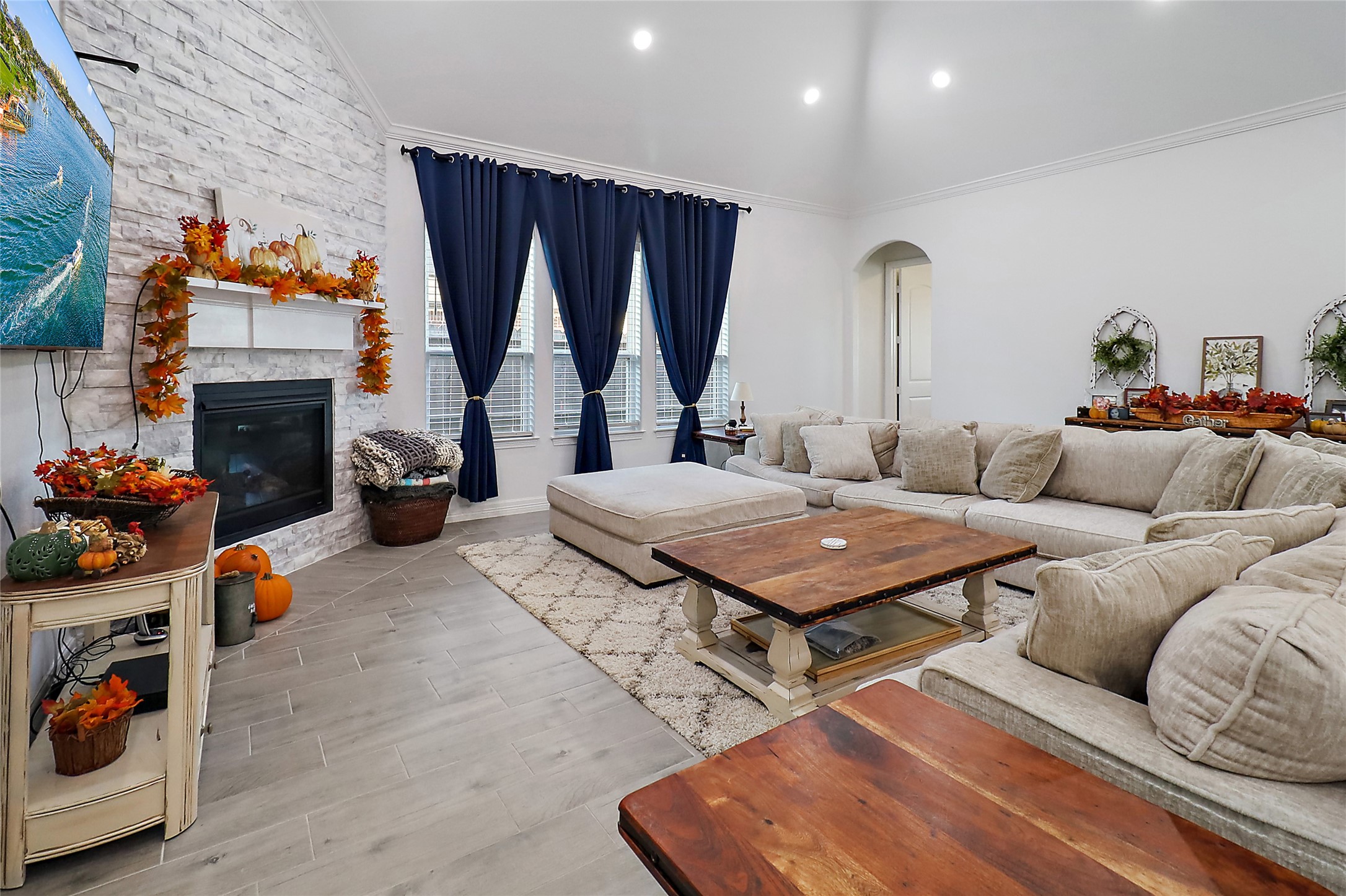 719 Cold Spring Drive Baytown, TX 77523 - Photo 9 of 33 a living room with furniture a fireplace and a table
