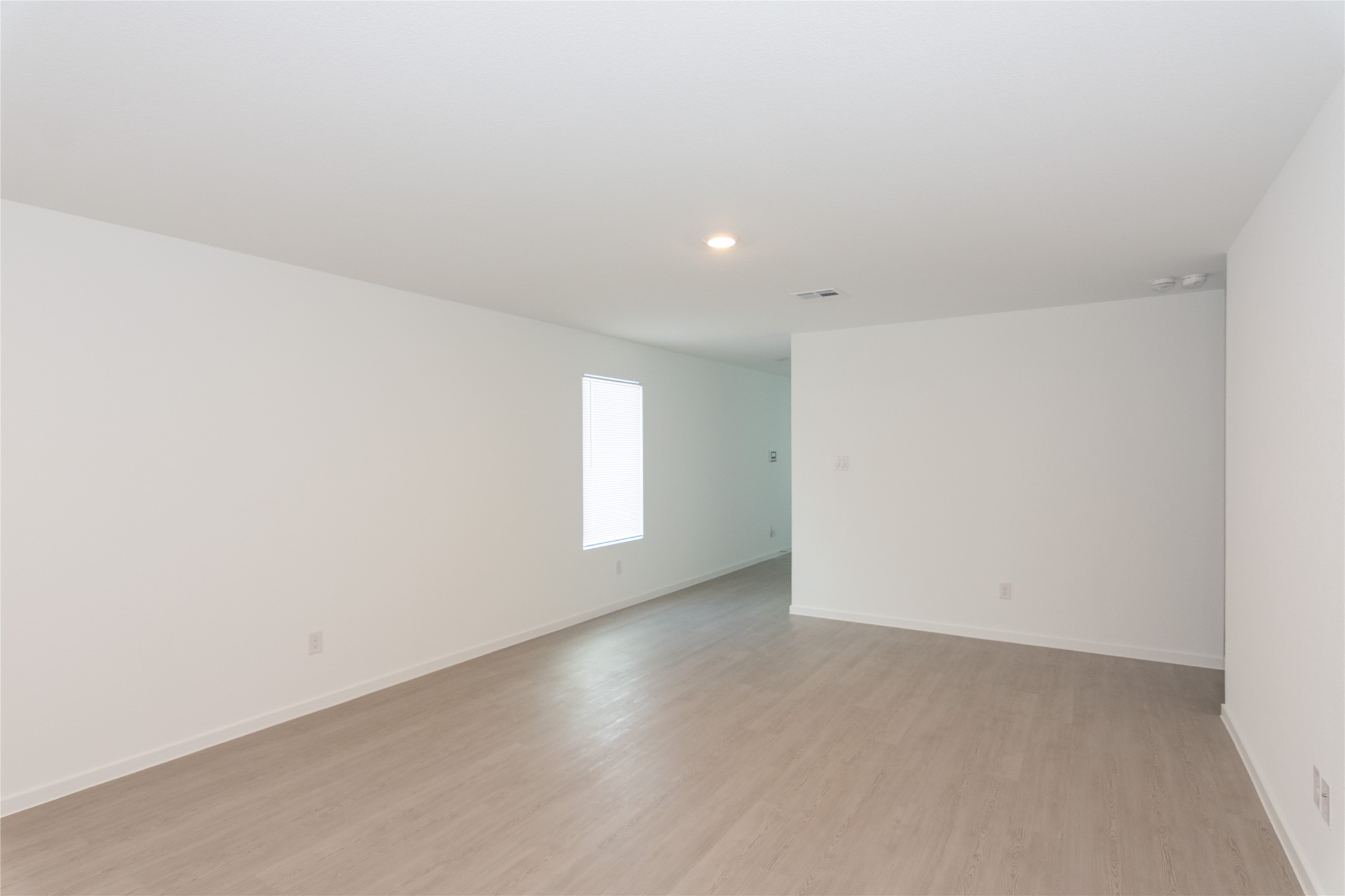 153 Star Packer Lane Jarrell, TX 76537 - Photo 5 of 30 A well-lit, neutral-toned living space awaits your personal touch.
