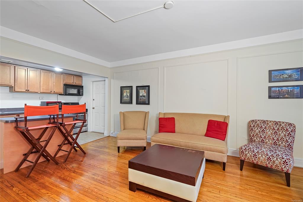 26 Pondfield Road, Unit E Bronxville, NY 10708 - Photo 4 of 10 Living room with light hardwood / wood-style floors