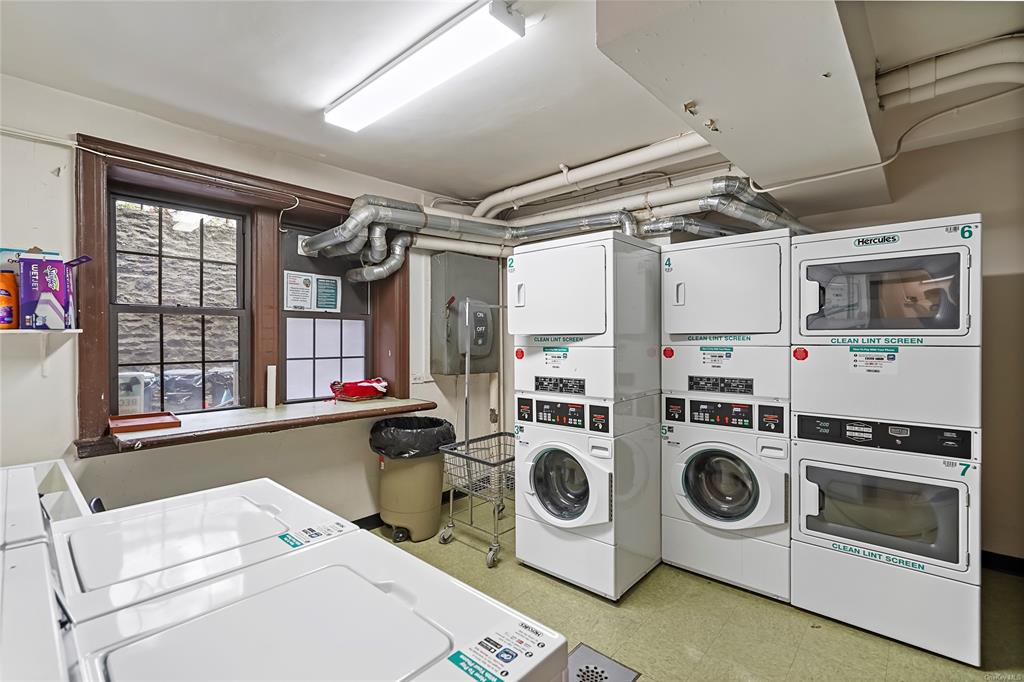 26 Pondfield Road, Unit E Bronxville, NY 10708 - Photo 10 of 10 Clothes washing area with stacked washer / dryer and washing machine and clothes dryer