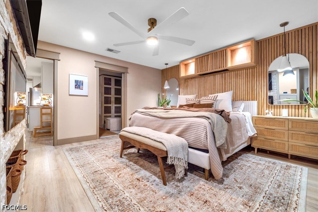 202 Ridgewood Avenue Clewiston, FL 33440 - Photo 42 of 50 a bedroom with a bed and a chandelier