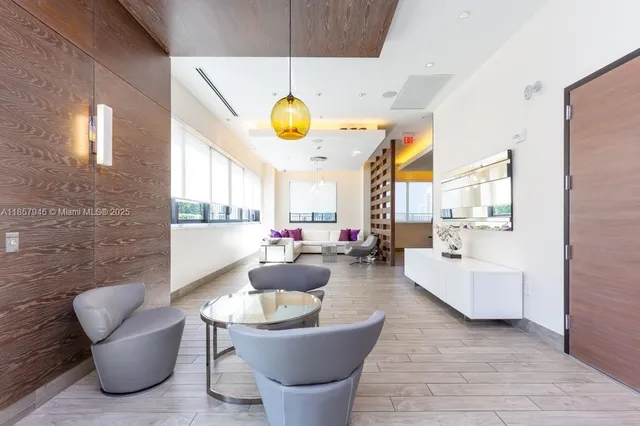 a living room with furniture a dining table and kitchen view