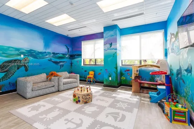 a swimming pool with outdoor seating and yard