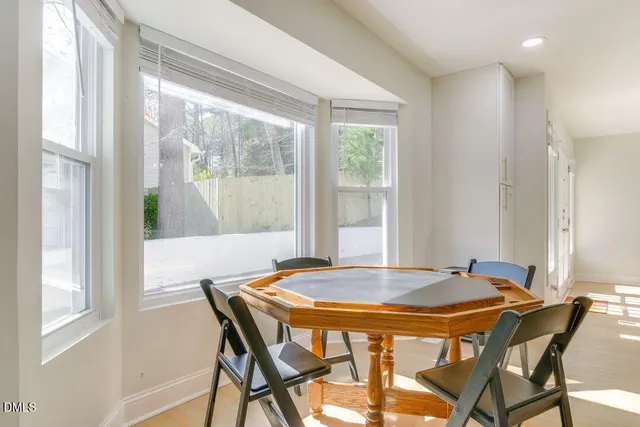 a dining room with furniture and window