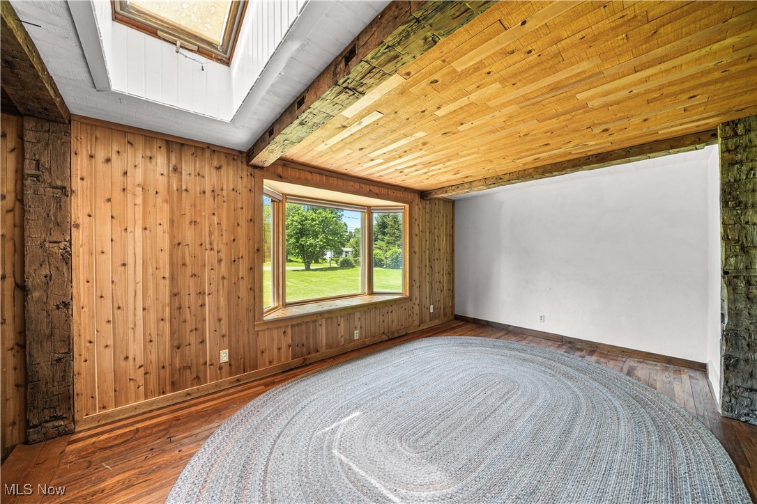 11828 Sheldon Road Mantua, OH 44255 - Photo 12 of 31 Spacious living room with hardwood, bay window and skylight