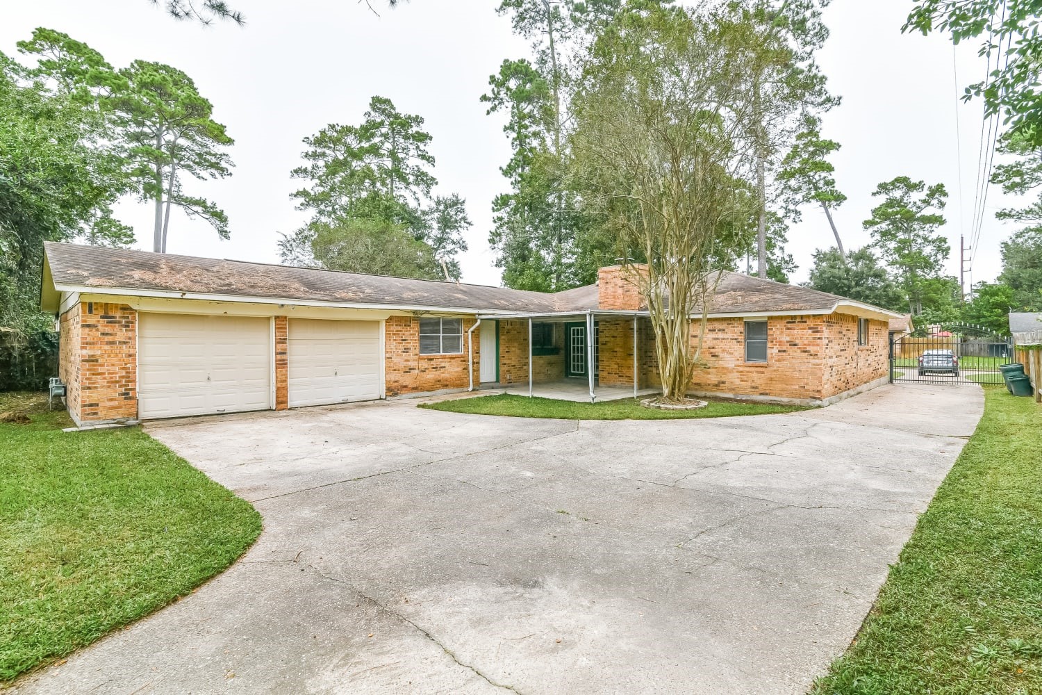 17411 Glenhew Road Humble, TX 77396 - Photo 13 of 14 a front view of a house with a garden and yard