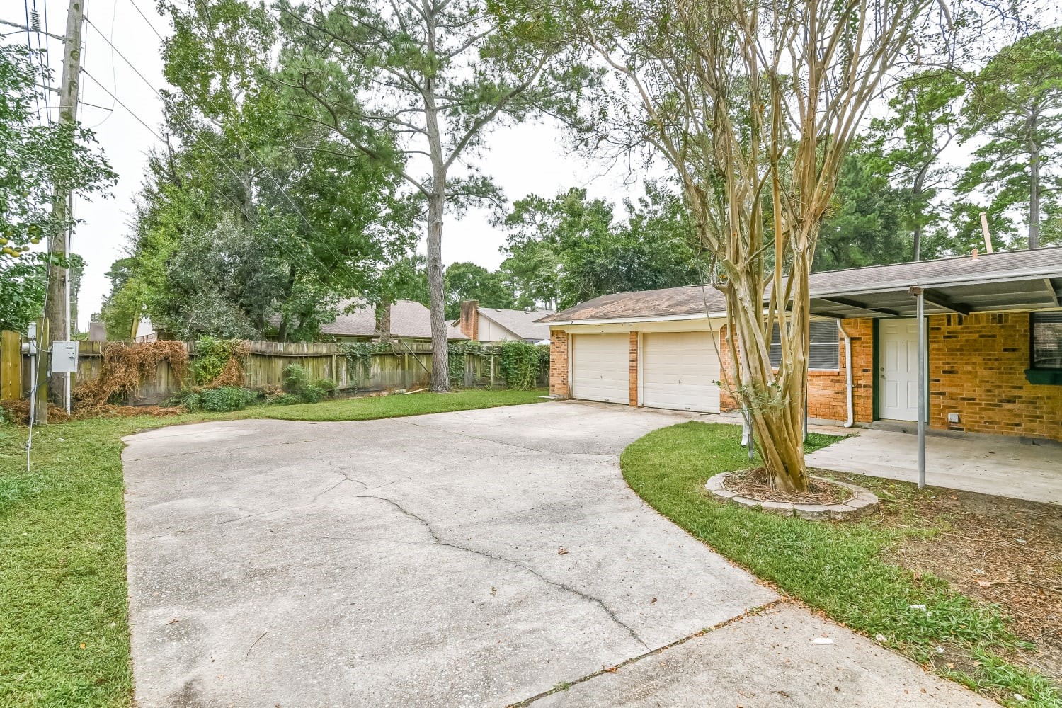 17411 Glenhew Road Humble, TX 77396 - Photo 14 of 14 a view of a house with backyard and a garden