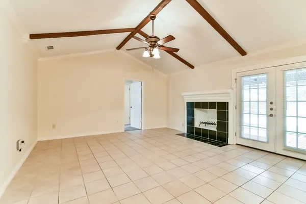 a view of a livingroom with a ceiling fan and window