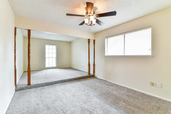 a view of an empty room with a window