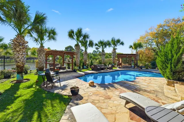 a view of a two chairs in the balcony