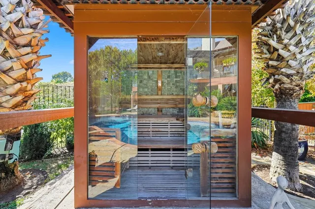 a view of a house with a yard and garden