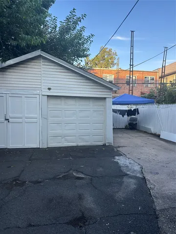 a small white building with a white roof